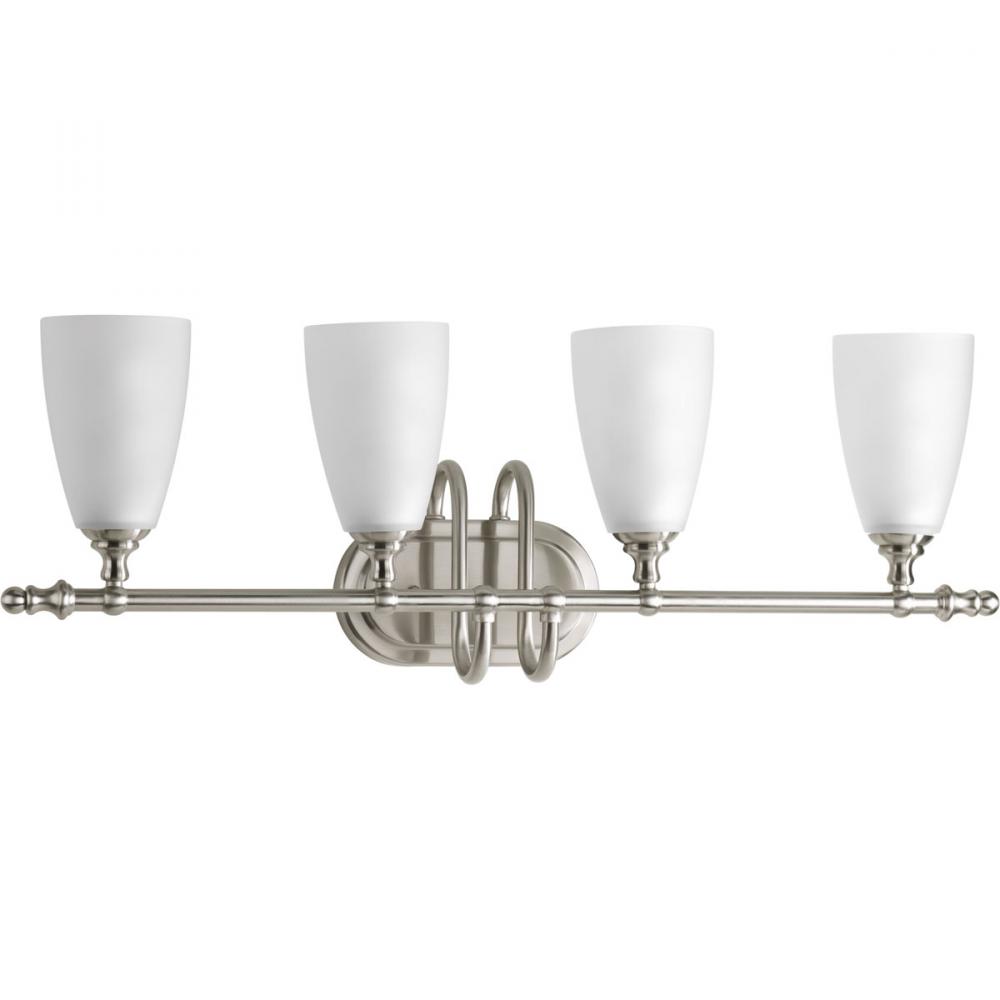 Four-light bath and vanity fixture finshed in brushed nickel with an etched glass shade. Part of the